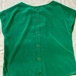 Green blouse in good condition. Buttons on the back.